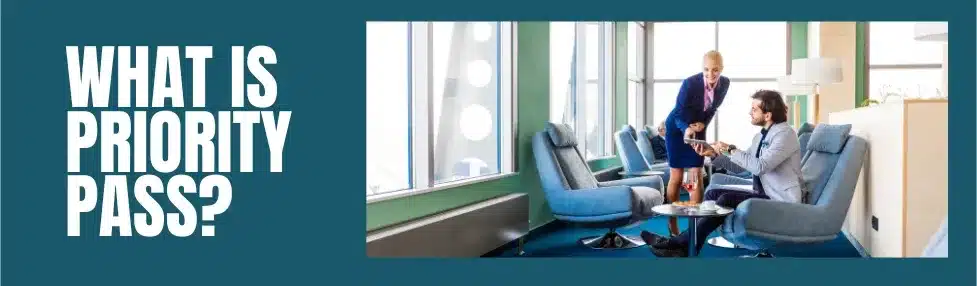 priority pass membership ultimate guide showing man in airport lounge blue armchair getting a drink