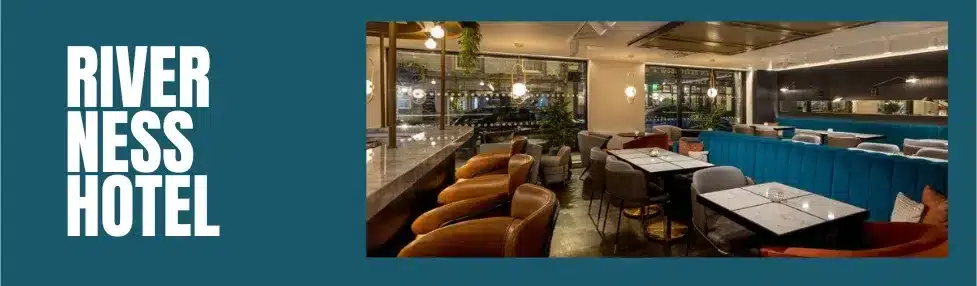 inverness city centre hotels image showing river ness hotel bar area with blue and brown seating