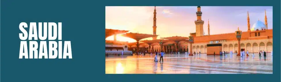 saudi arabia square with minarets and mosque in the background and people walking through the square