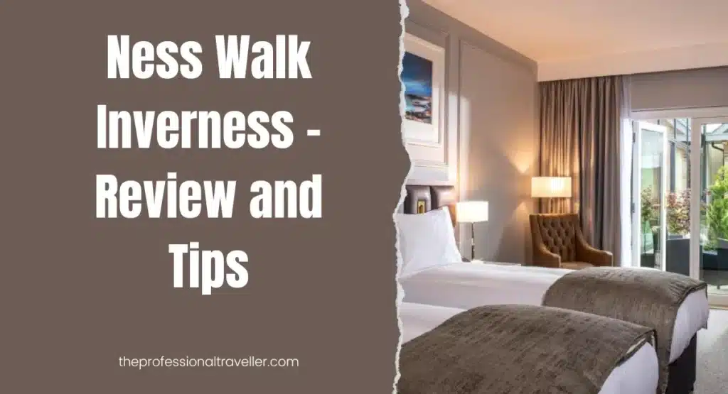 a room with two beds and a brown chair ness walk inverness hotel