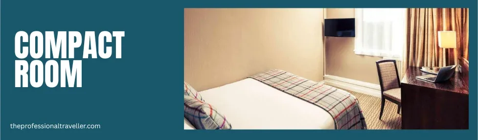 mercure inverness compact double room image showing bed, desk with chair and tv on the wall