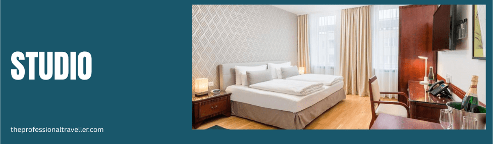 best western plus celebrity suites vienna image showing studio roomwith double bed, desk and chair, wardrobe and windows