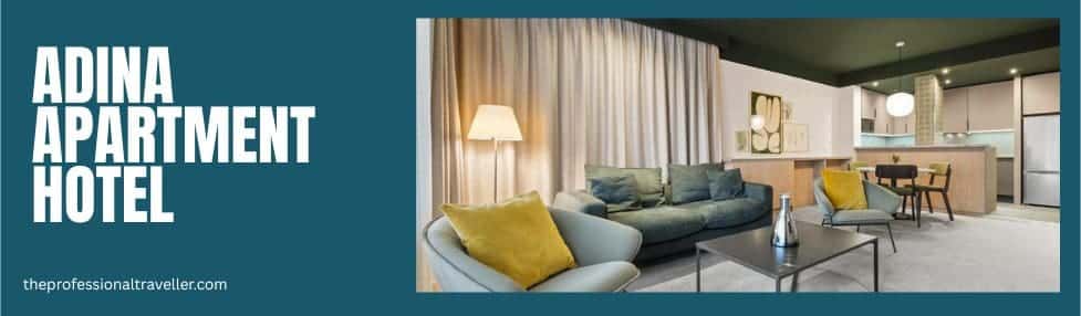 where to stay in budapest image showing the adina apartment hotel 1 bedroom suite with lounge and kitchen area